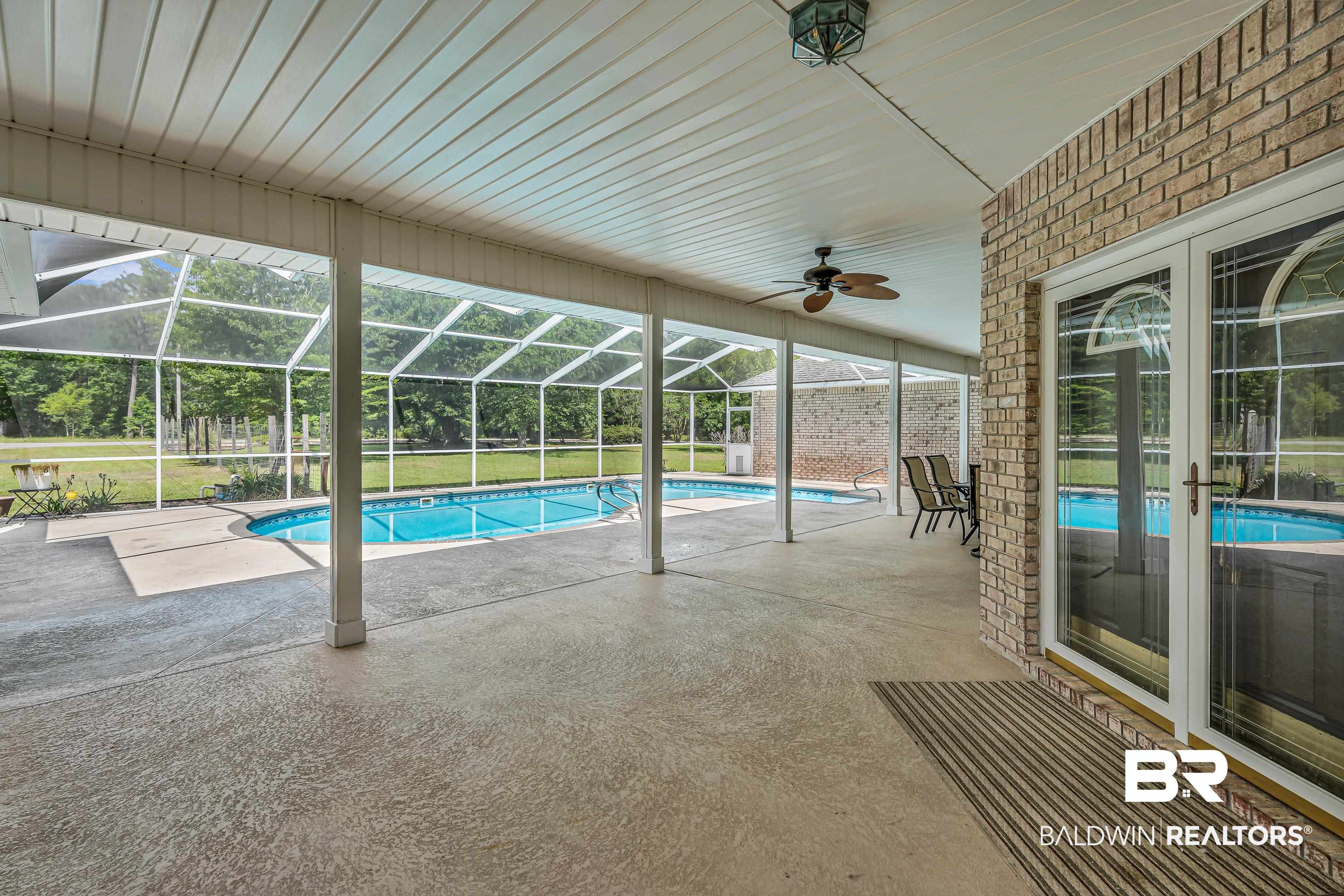 9530 Pilgrim Drive Elberta, AL 36530 - Photo 37 of 61 Pool featuring a patio, ceiling fan, and glass enclosure