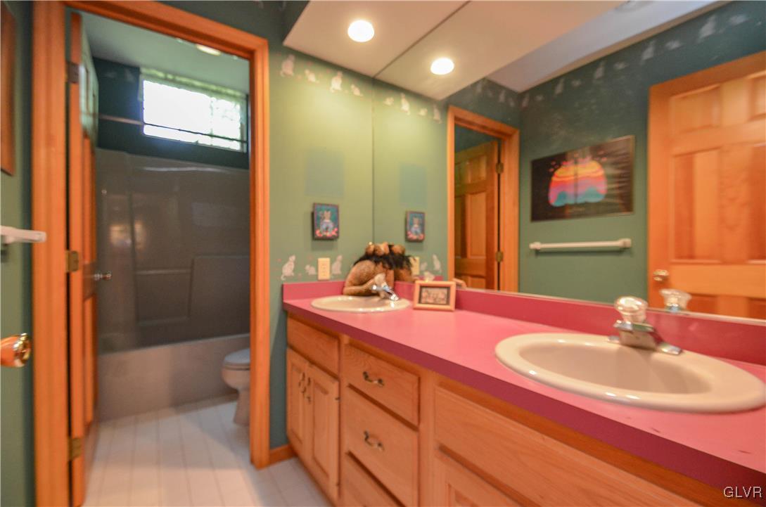 375 Woodline Road Nazareth, PA 18064 - Photo 14 of 22 a bathroom with a sink double vanity and a mirror