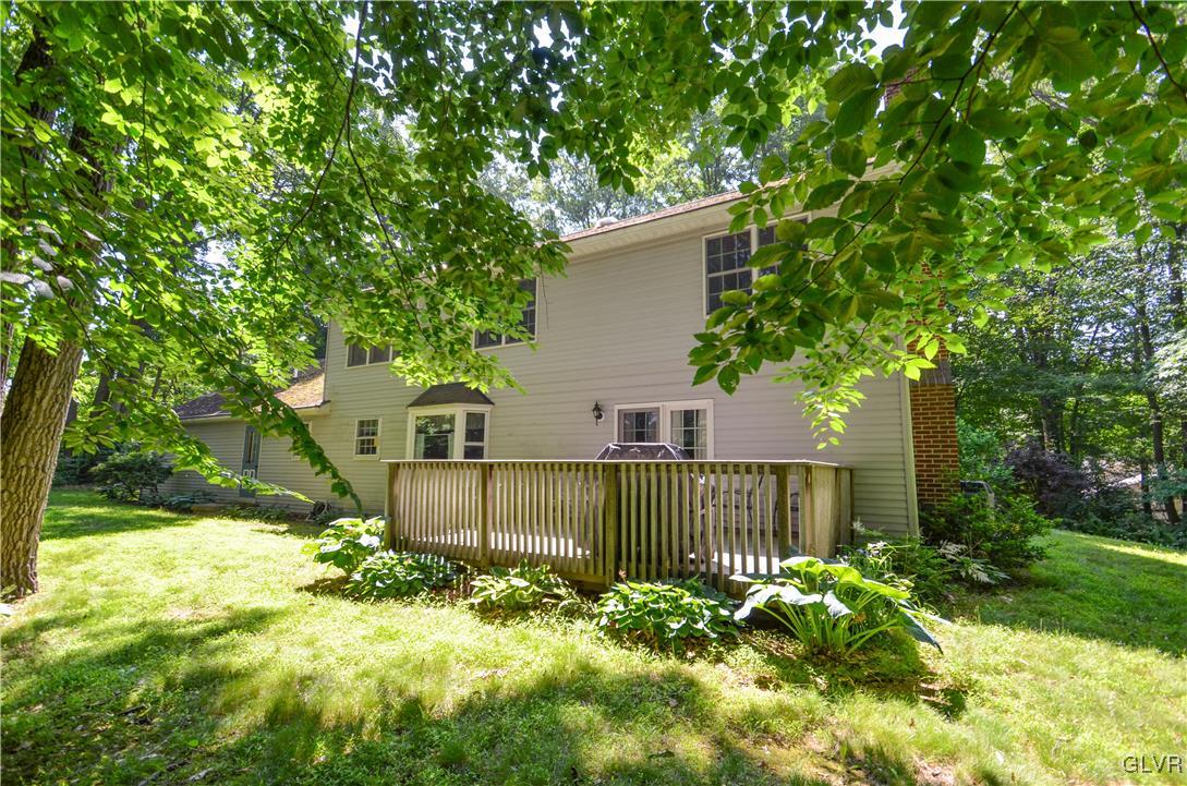 375 Woodline Road Nazareth, PA 18064 - Photo 22 of 22 a front view of a house with a yard table and chairs