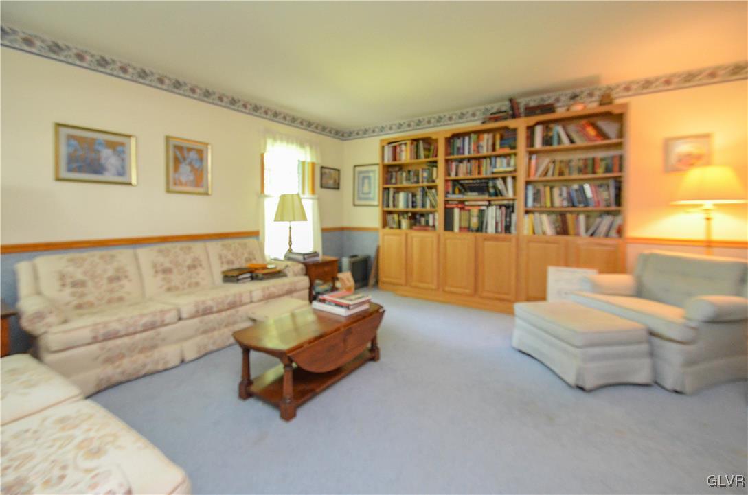 375 Woodline Road Nazareth, PA 18064 - Photo 7 of 22 a living room with furniture and a large window with bookshelf