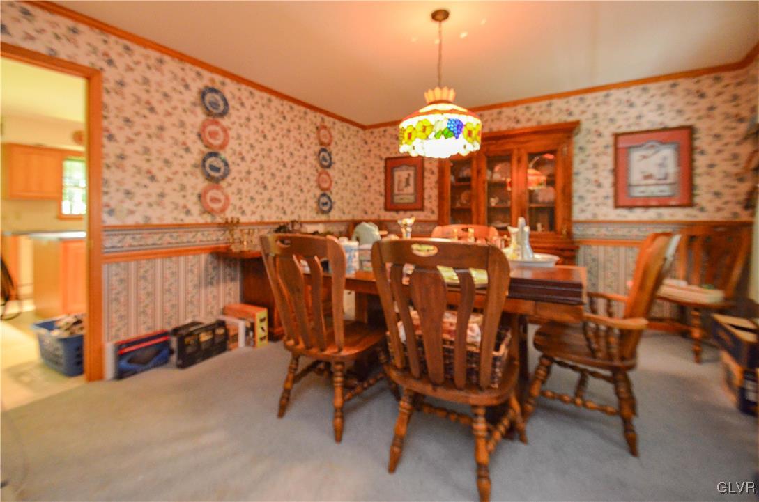 375 Woodline Road Nazareth, PA 18064 - Photo 8 of 22 a view of a dining room with furniture and a chandelier
