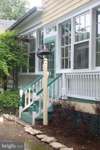 6948 North Clifton Road Frederick, MD 21702 - Photo 21 of 30 Side Entrance - W/Wisteria Wrapped Pergola