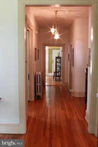 6948 North Clifton Road Frederick, MD 21702 - Photo 5 of 30 Main Hallway w/Refininshed Heart Pine Floors