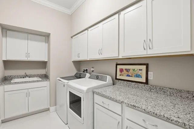 a view of cabinets with washer and dryer