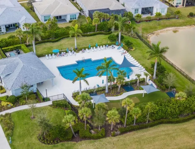 an aerial view of a house with garden space and street view
