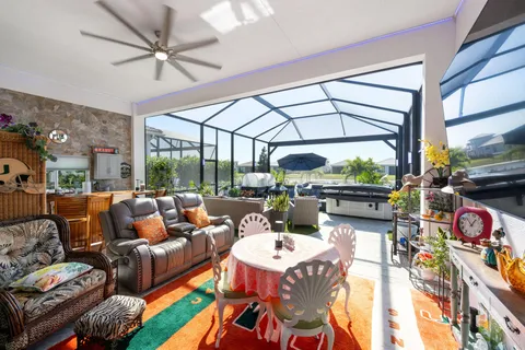 a bathroom with a sink mirror and a shower