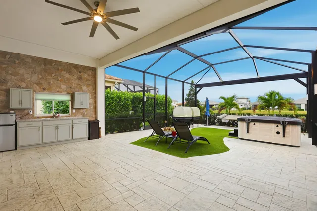 a view of a chairs and table in patio of a house