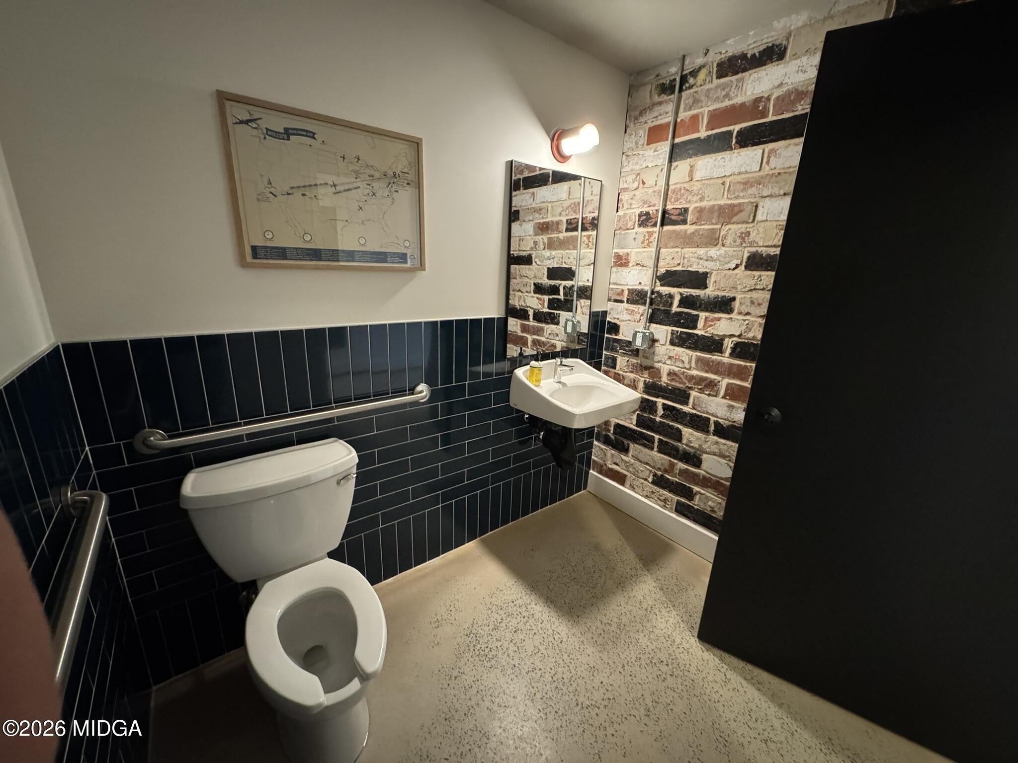 1080 3rd Street Macon, GA 31201 - Photo 4 of 18 a bathroom with a toilet and a shower