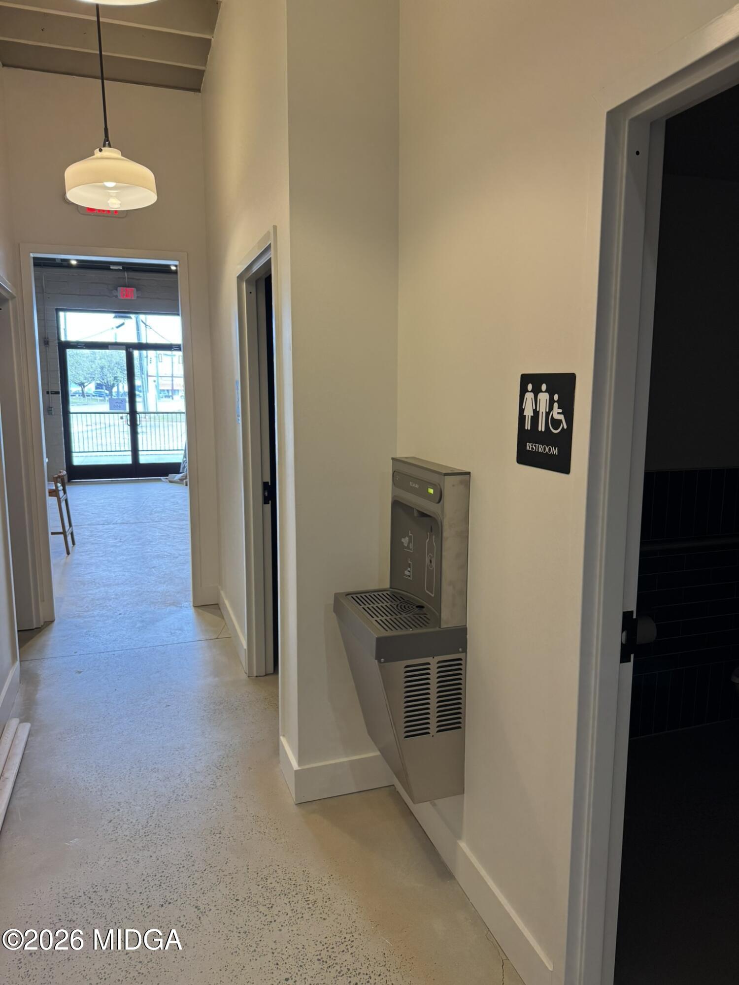 1080 3rd Street Macon, GA 31201 - Photo 8 of 18 a view of a hallway with wooden floor and a cabinet