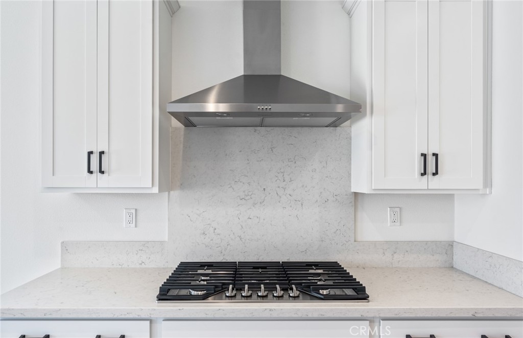 25344 Picket Range Way Menifee, CA 92586 - Photo 13 of 29 a stove top oven sitting inside of a kitchen