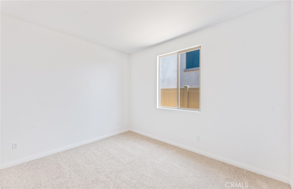 25344 Picket Range Way Menifee, CA 92586 - Photo 24 of 29 a view of an empty room with a window