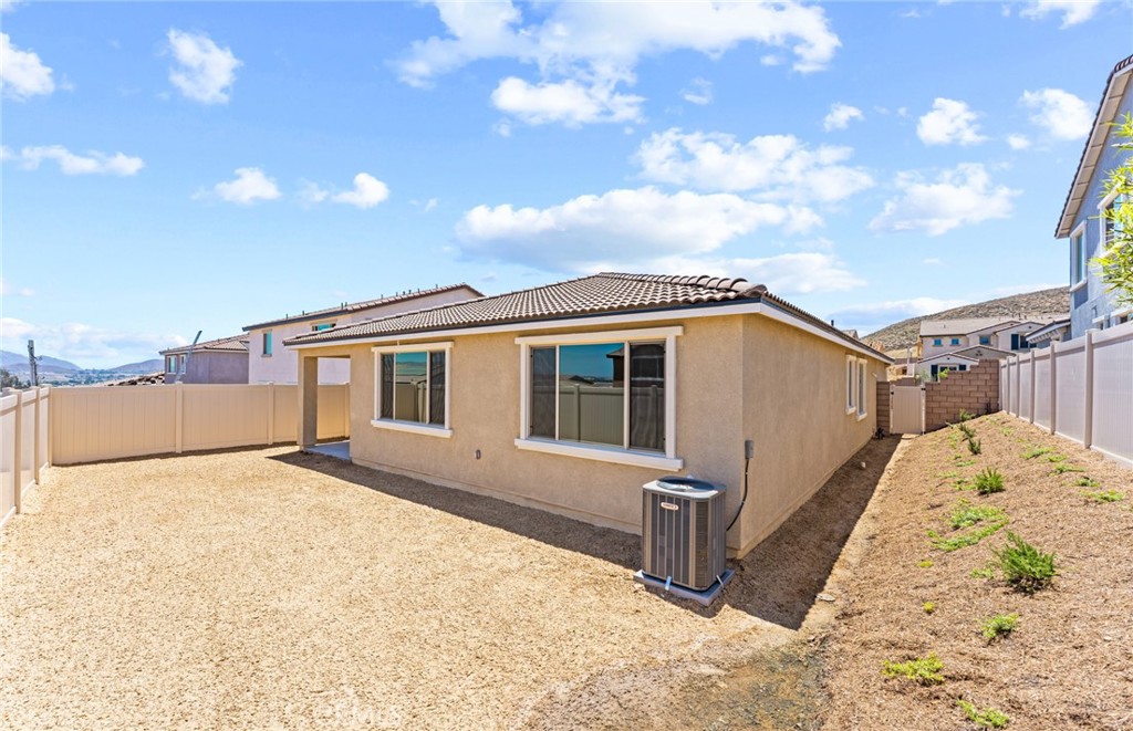 25344 Picket Range Way Menifee, CA 92586 - Photo 29 of 29 a view of a house with wooden fence