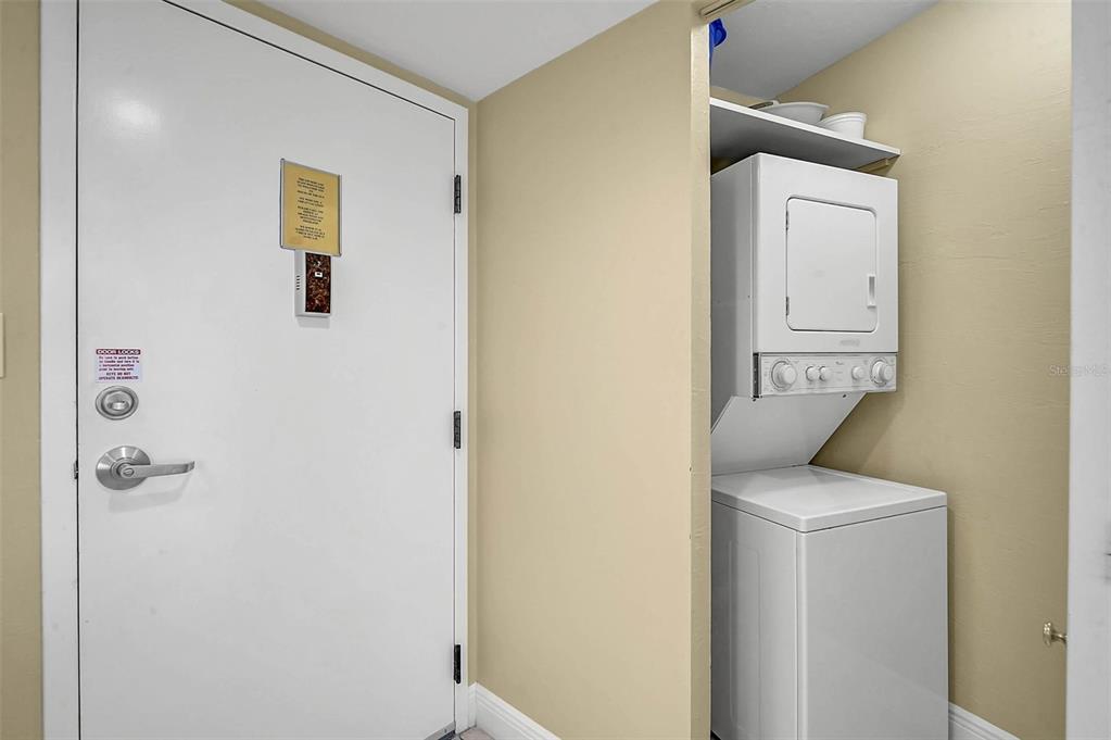 6518 Midnight Pass Road, Unit 407 Sarasota, FL 34242 - Photo 13 of 48 a bathroom with a sink and mirror