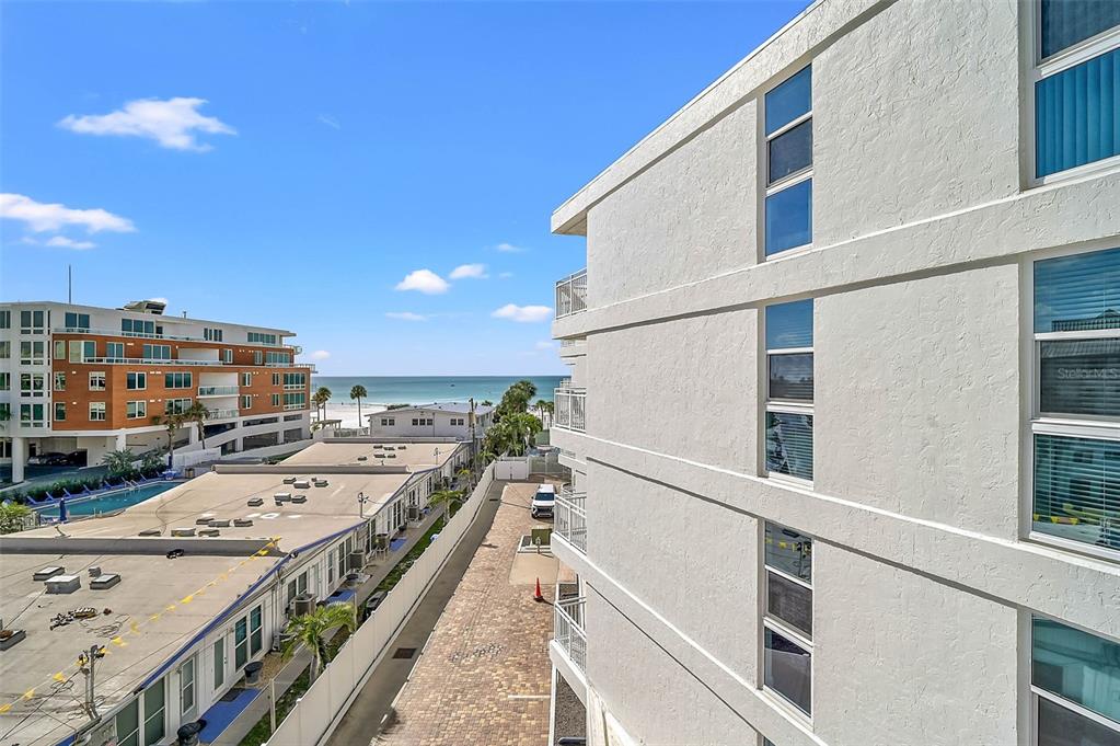 6518 Midnight Pass Road, Unit 407 Sarasota, FL 34242 - Photo 3 of 48 a view of a balcony with a kitchen
