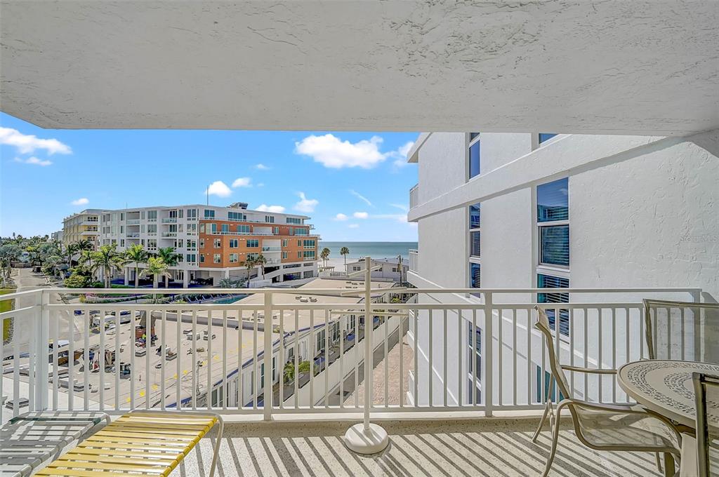6518 Midnight Pass Road, Unit 407 Sarasota, FL 34242 - Photo 31 of 48 a view of a balcony with furniture