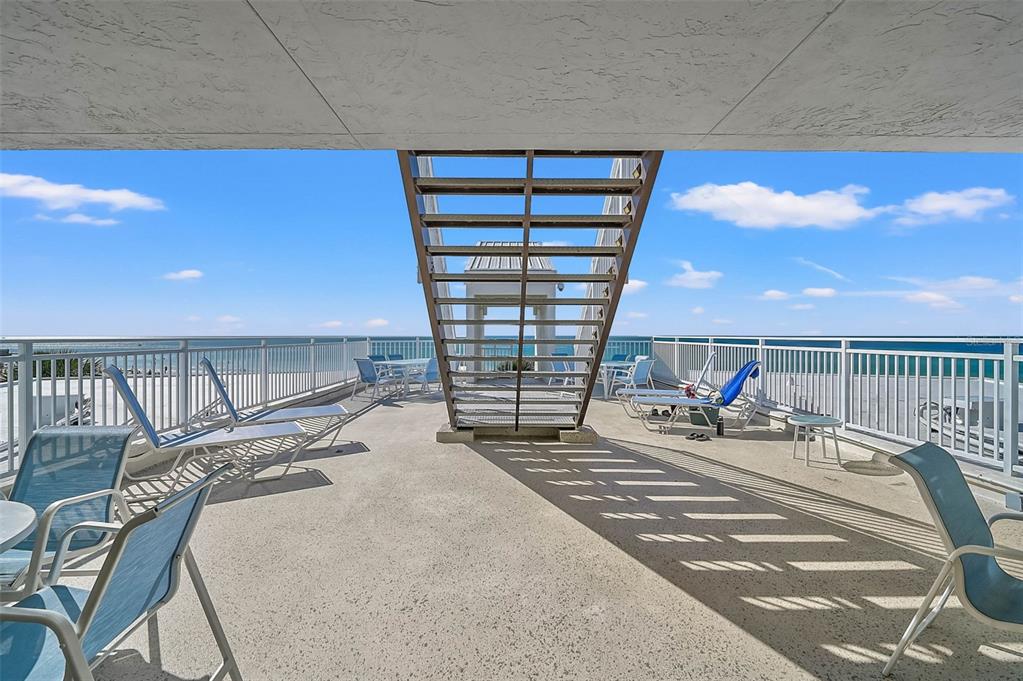 6518 Midnight Pass Road, Unit 407 Sarasota, FL 34242 - Photo 7 of 48 a bed sitting in a bedroom next to a window