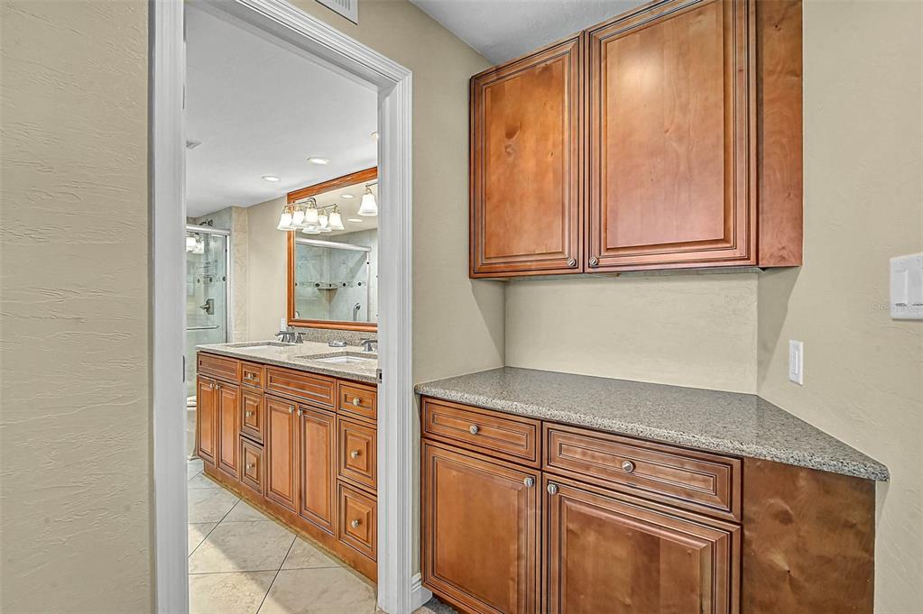 6518 Midnight Pass Road, Unit 407 Sarasota, FL 34242 - Photo 9 of 48 a kitchen with stainless steel appliances granite countertop a refrigerator and cabinets