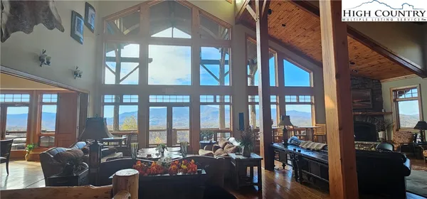 a view of a balcony with a floor to ceiling window and wooden floor