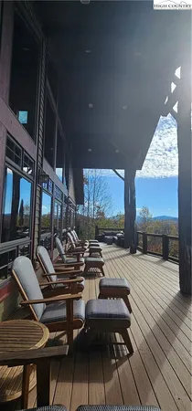 a dining room with furniture window and wooden floor