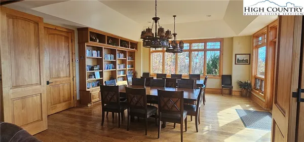 a view of a livingroom with workspace and a window