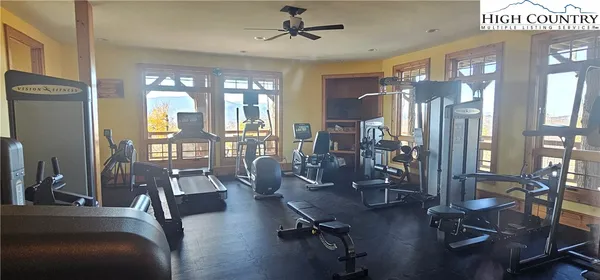 a view of a room with furniture and windows