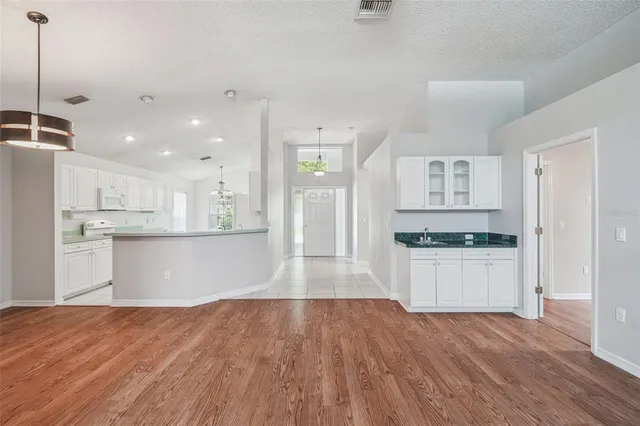 a bathroom with a shower a toilet and a sink