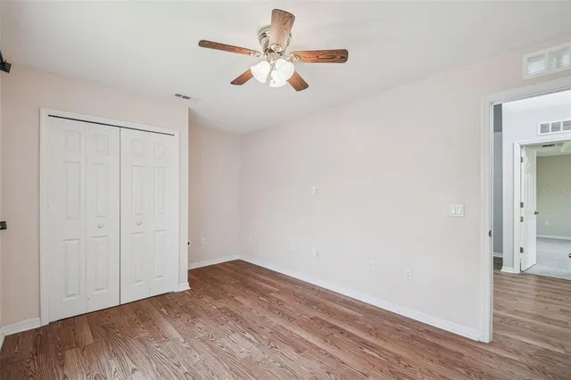 a view of a garden with a building in the background