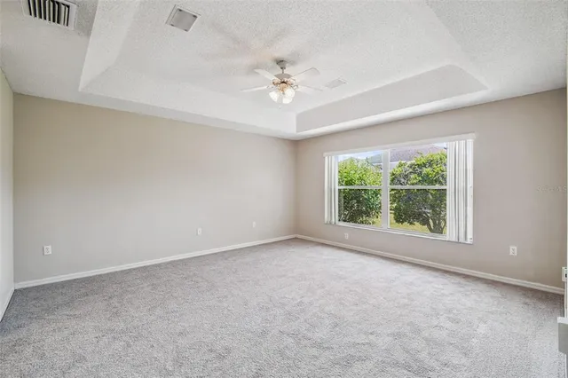 an aerial view of a houses with a lot of trees