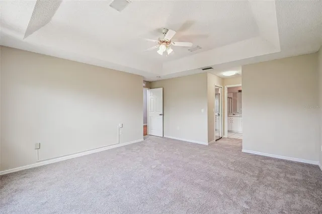 an aerial view of a house with a garden and a yard