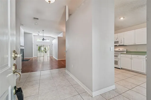 a view of an entryway with wooden floor