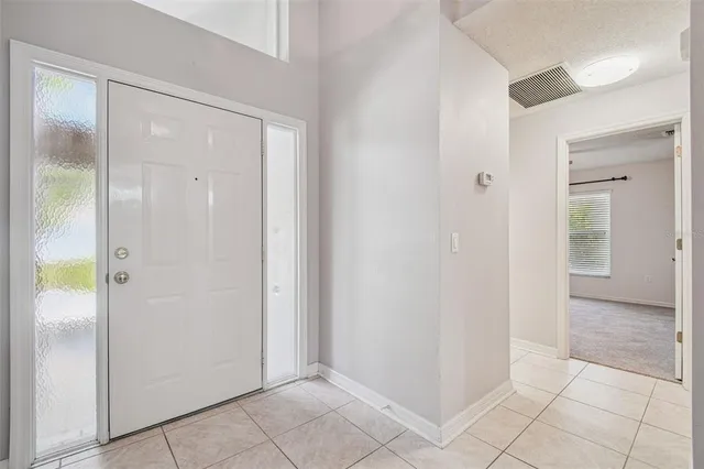 a kitchen with cabinets and window