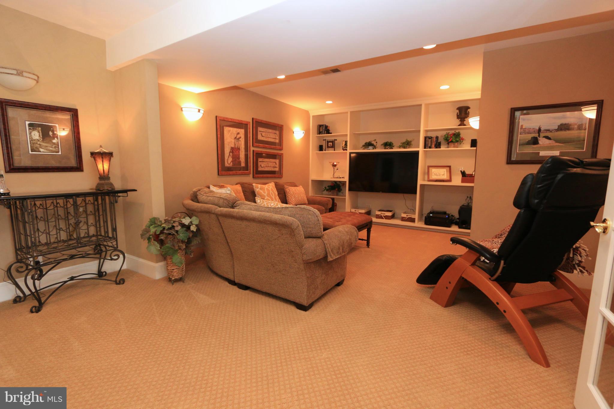11571 Lake Newport Road Reston, VA 20194 - Photo 24 of 30 Theater Room with Built-In Shelving/Speakers