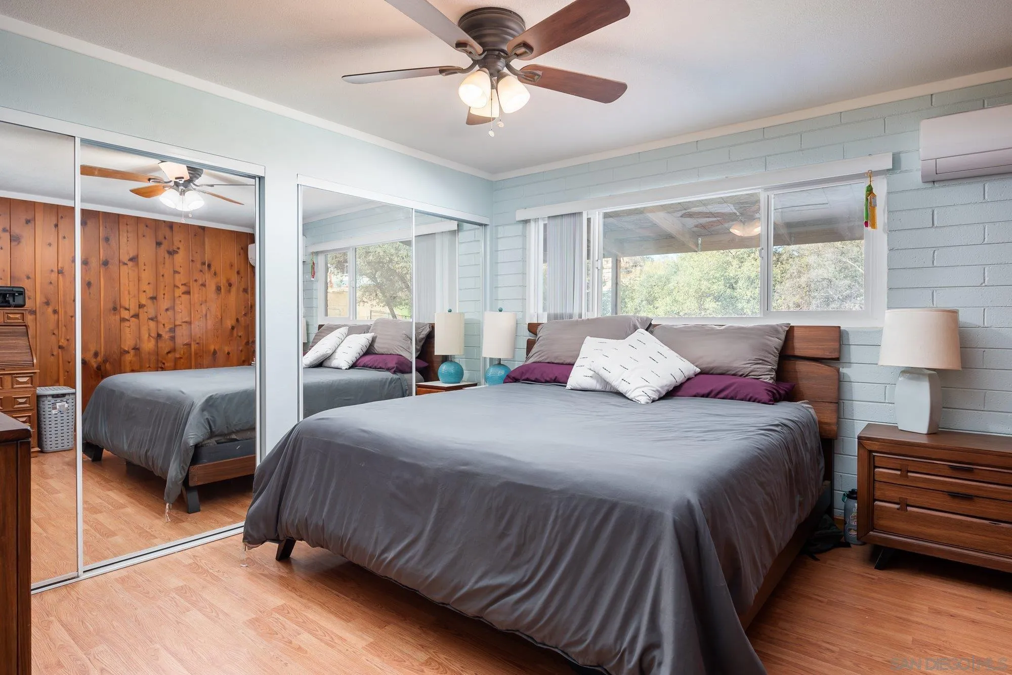 1241 Marshall Road Alpine, CA 91901 - Photo 9 of 21 a bedroom with a bed and wooden floor