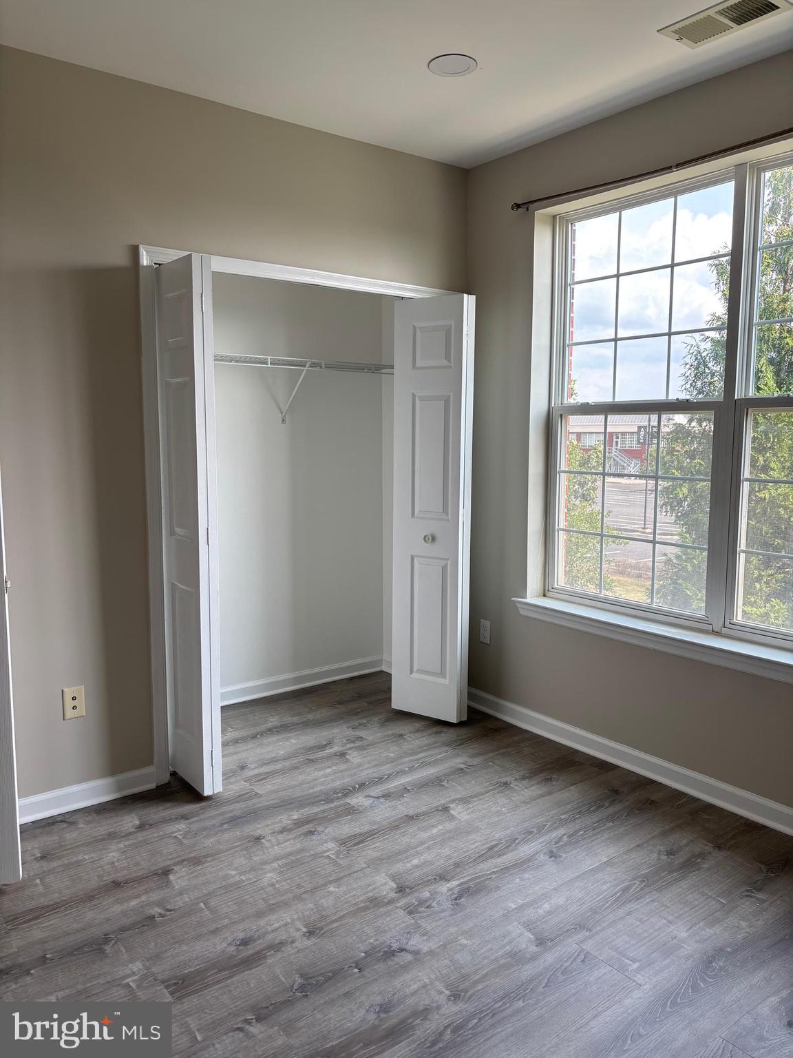 1321 Sierra Drive Hamilton, NJ 08619 - Photo 14 of 33 an empty room with wooden floor and windows