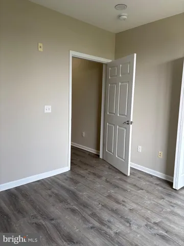 a white toilet sitting next to a shower