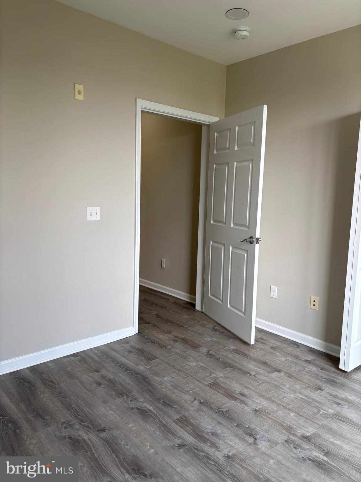1321 Sierra Drive Hamilton, NJ 08619 - Photo 15 of 33 an empty room with wooden floor and closet area
