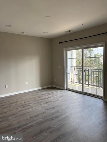 a view of a kitchen with a sink and dishwasher wooden floor