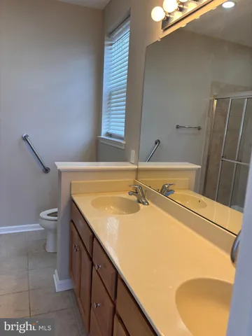 a bathroom with a glass shower door
