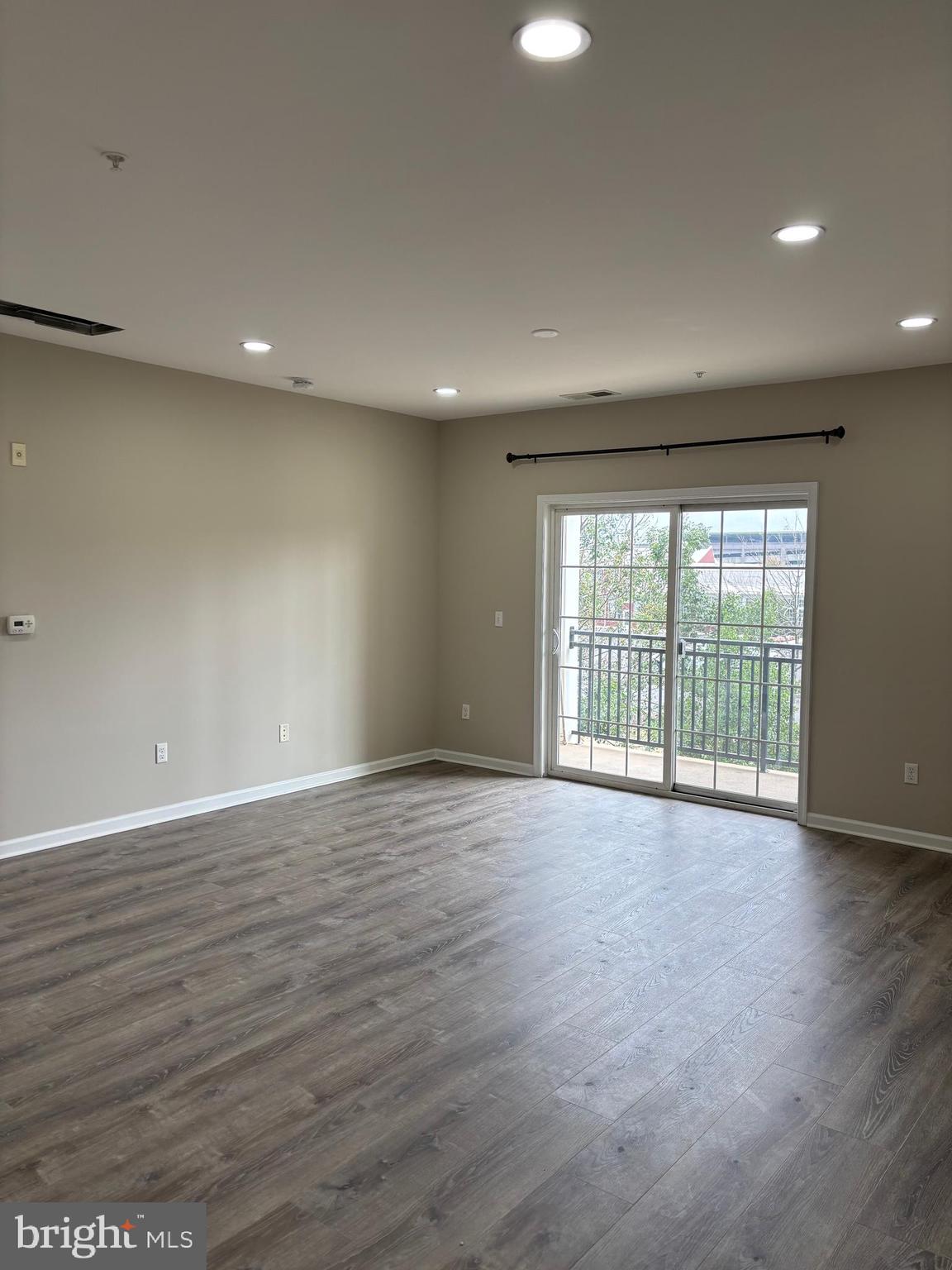 1321 Sierra Drive Hamilton, NJ 08619 - Photo 28 of 33 a view of an empty room with wooden floor and a window