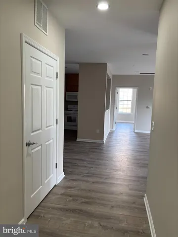 a kitchen with a refrigerator and cabinets