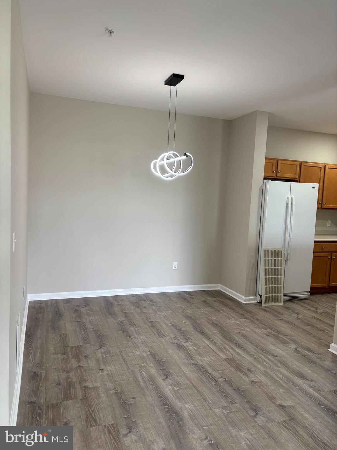 1321 Sierra Drive Hamilton, NJ 08619 - Photo 9 of 33 a view of an empty room with wooden floor and windows