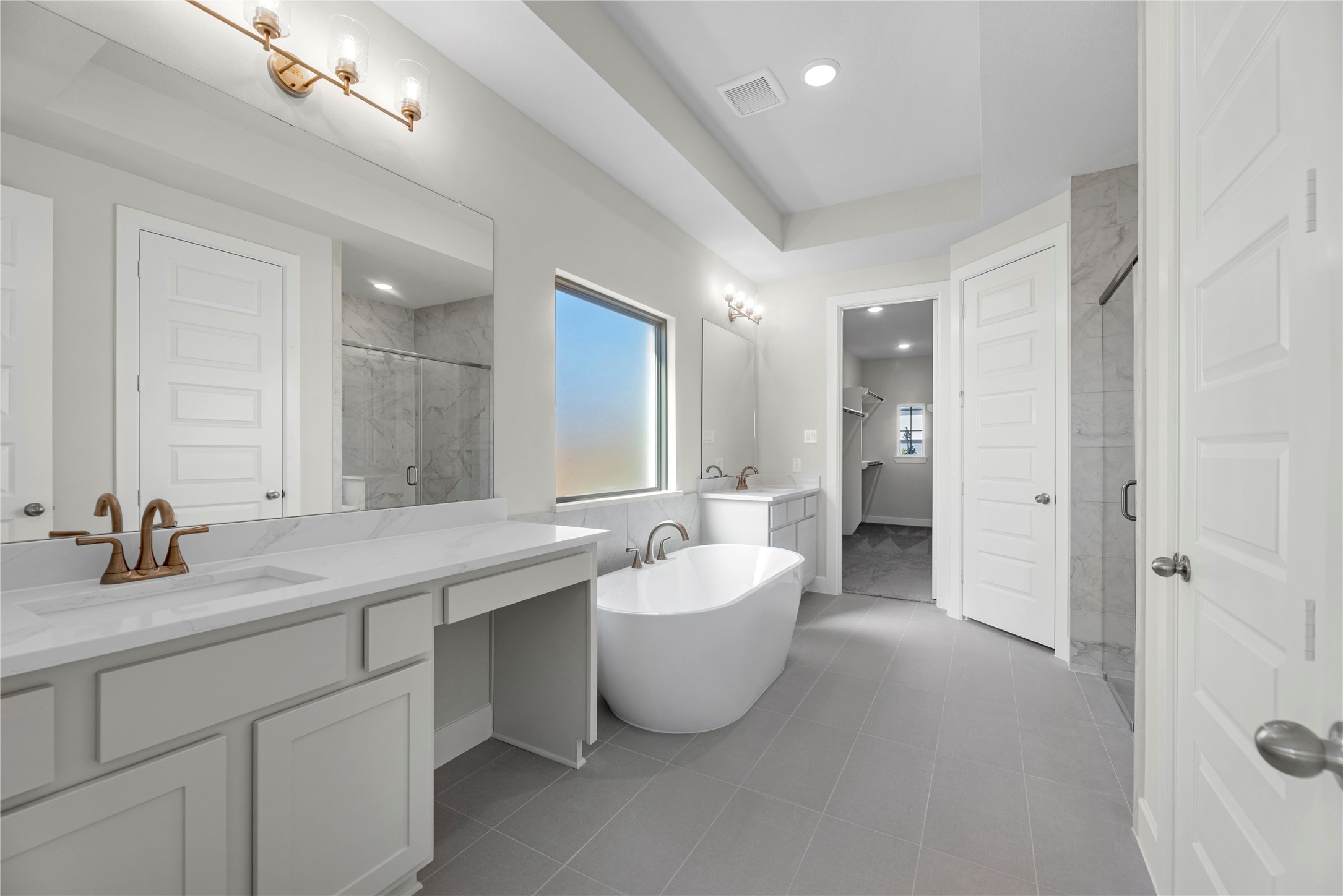 5023 Nesbit Path Rosenberg, TX 77471 - Photo 12 of 25 a bathroom with a double vanity sink mirror and bathtub