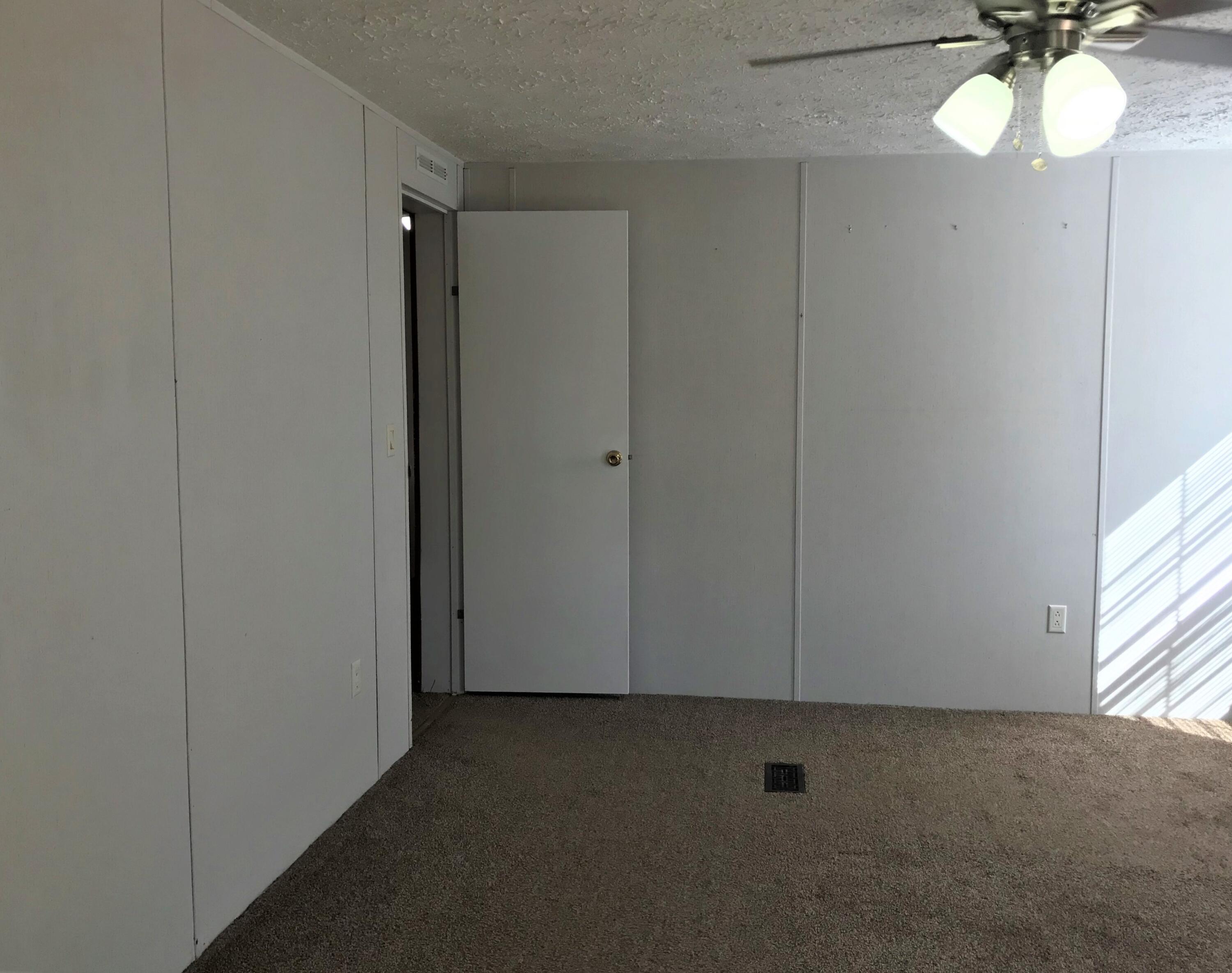 5806 Bush Road Baker, FL 32531 - Photo 11 of 17 a view of an empty room and a window
