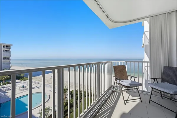 a view of a balcony with chairs