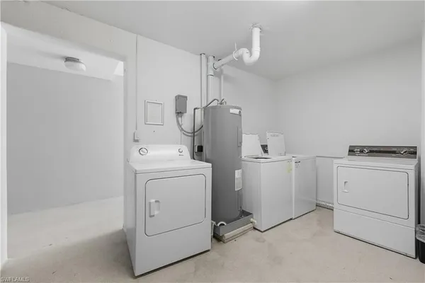 a view of storage and utility room with washer and dryer