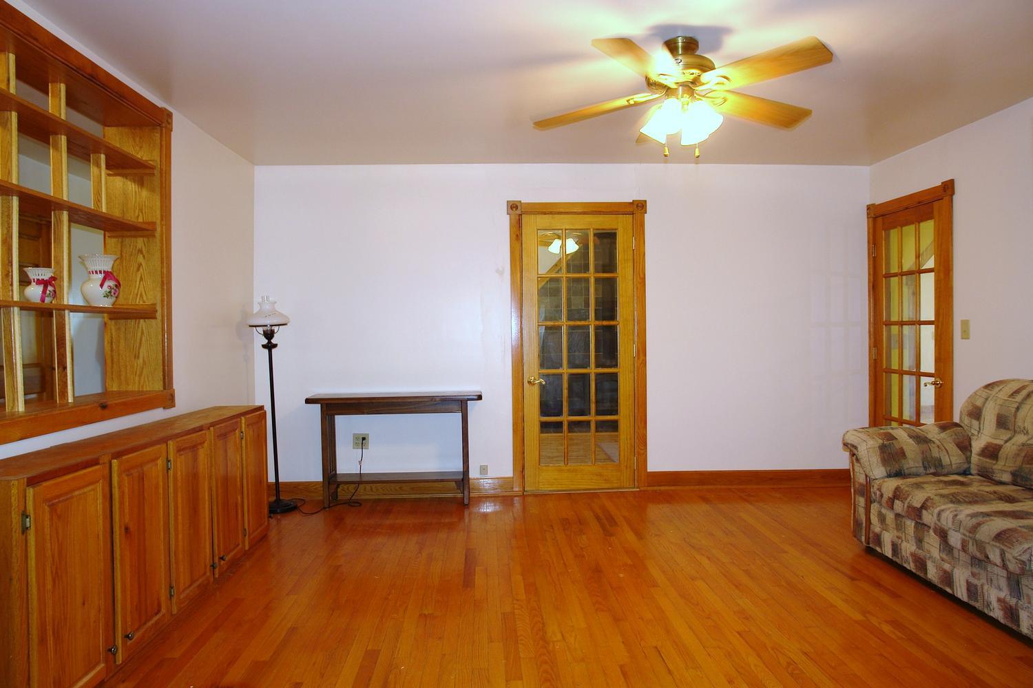 2438 Villamont Road Blue Ridge, VA 24064 - Photo 14 of 47 a view of an empty room with window and wooden floor