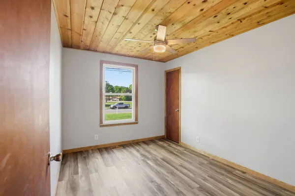a view of an empty room with a window