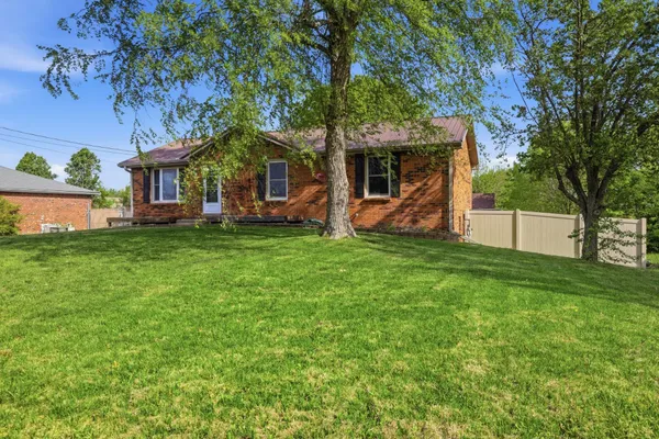 front view of a house with a yard