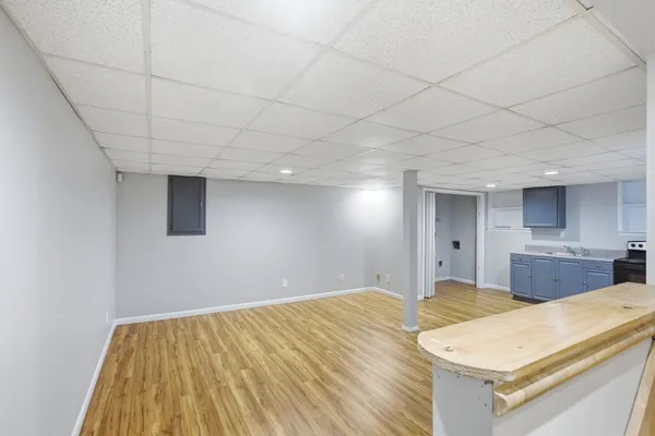 a room with a bed and a dresser