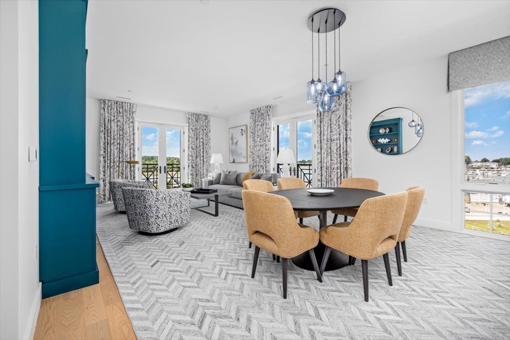 10 Shipyard Drive, Unit 312 Hingham, MA 02043 - Photo 1 of 32 a view of a dining room with furniture window and wooden floor